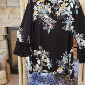 Black and floral top with gold bar clasp, lace end